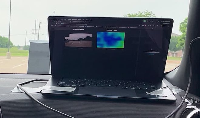 Laptop on the dashboard showing the camera feed and thermal feed side by side